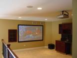 Home theater systems.  Projectors, lighting, curtain, sound, in wall racks, custom controls.